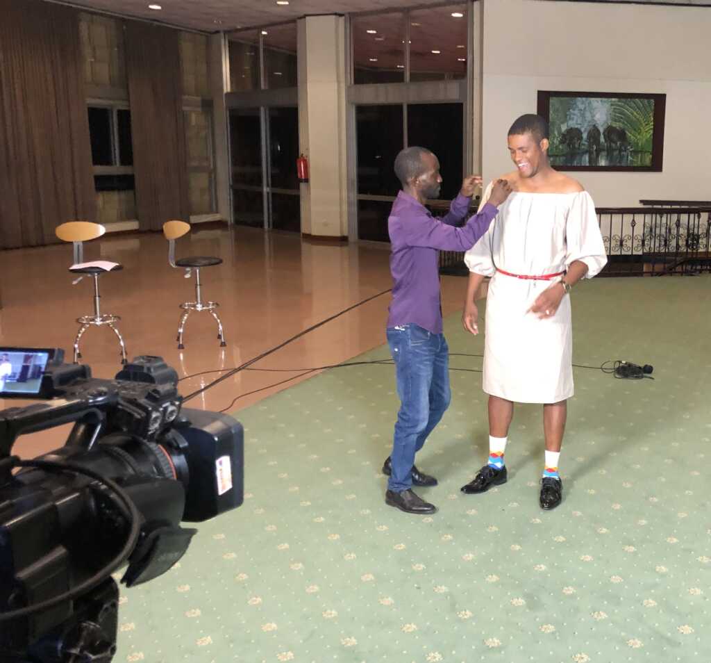 Andrew Kabura preparing for NTV Press Box in a dress
