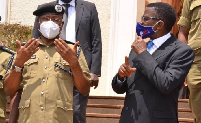 Police political commissar AIGP Asan Kasingye with Buganda Prime Minister Katikkiro Charles Peter Mayiga
