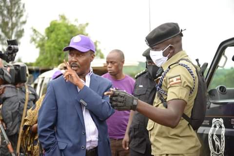 ANT leader Maj Gen (Rtd) Gregg Mugisha Muntu engages with police officers.