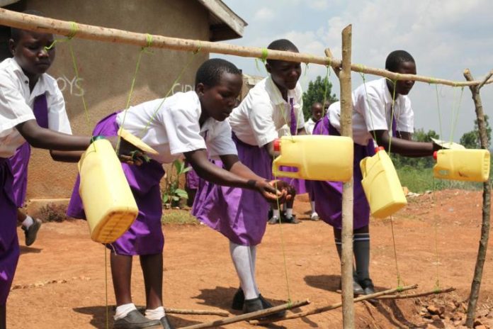 Ugandan school children washing hands. Photo by Catherine Ntabadde, Unicef.jpg