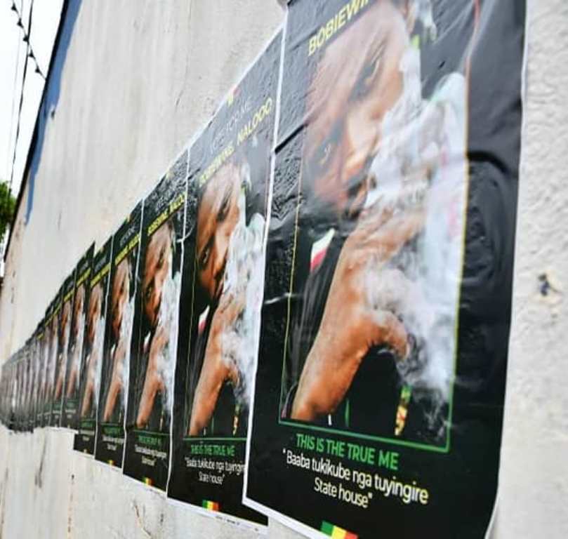 Posters of Bobi Wine smoking weed. 