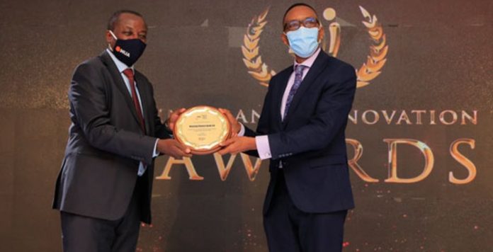Housing Finance Bank managing director Michael Mugabi receives the award for the most innovative bancassurance agent at the Annual Insurance Innovation Awards held at the Kampala Serena Hotel on December 18.