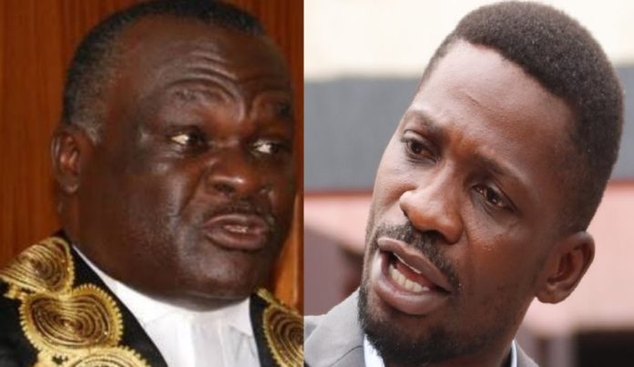 Judiciary head Alfonse Chigamoy Owiny Dollo and Bobi Wine