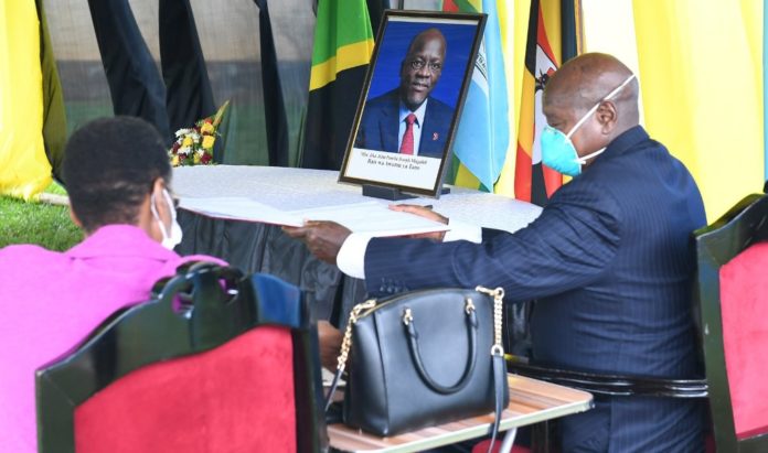 Museveni signs Magufuli condolence book on the day the two were supposed to sign an oil pipeline deal