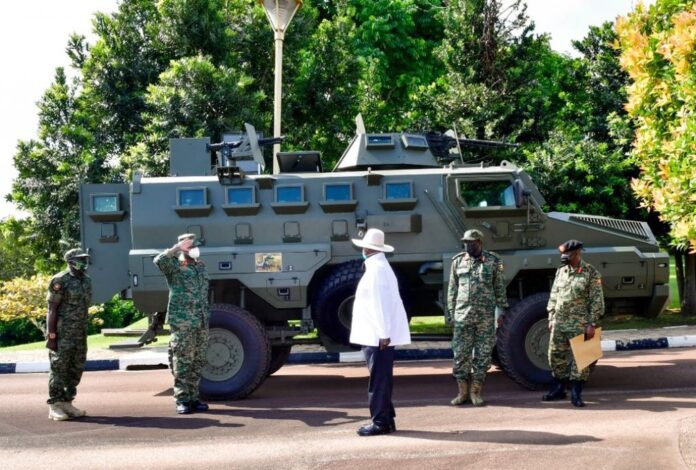 Museveni saluted by first son CLF Muhoozi Kainerugaba during the commissioning of Infantry Fighting Vehicle 'Chui'.