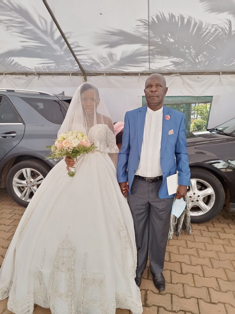 Ofwono Opondo marches daughter Alice Opondo to All Saints Nakasero for her wedding to Eng Ivan Katende