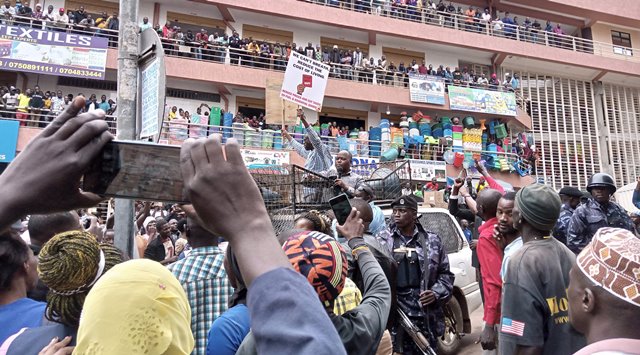 JUST IN: Besigye Finally Beats Security at Kasangati Home; Launches 'Muzukuke' Protests in City Centre