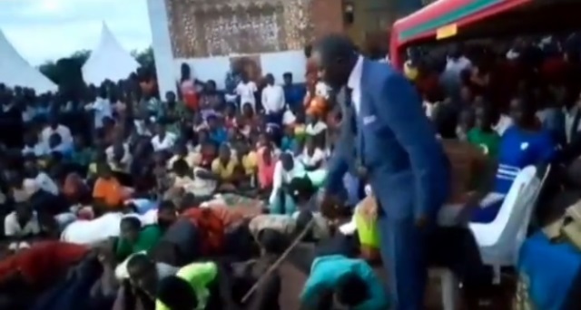 SHOCKING VIDEO: Watch Shameless Pastor Beating Church Members for Refusing to Pay Tithe