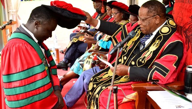 Chancellor Prof. Ezra Susruma Confers A Doctorate To One Of The PhD Graduates During The 72nd Mak Graduation. Photo By Makerere University 
